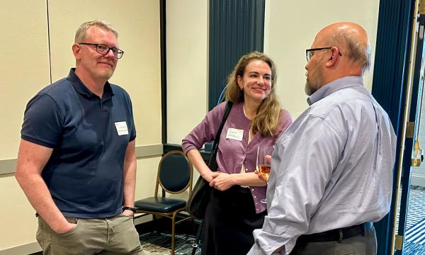 Attendees mingle and chat.
